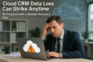 Worried business professional looking at laptop screen showing cloud CRM data loss warning and recovery alert