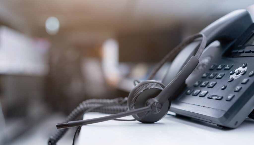 Smart phone systems with modern desk phone and headset for business communication